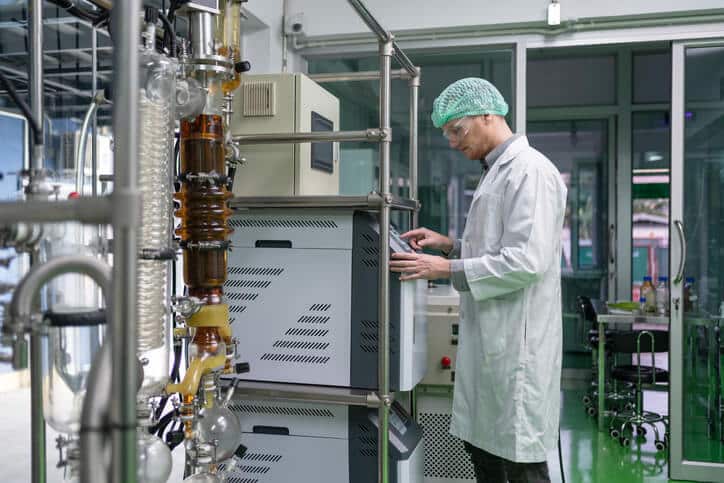 A cannabis extraction technician in a laboratory after earning their cannabis certificate
