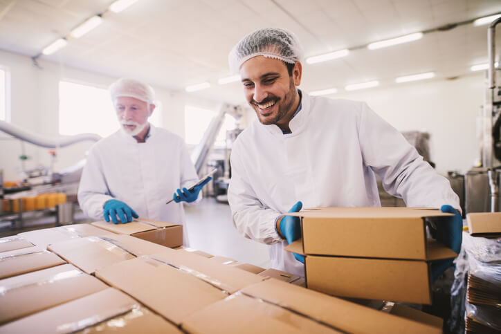 Two quality assurance professionals after food safety training