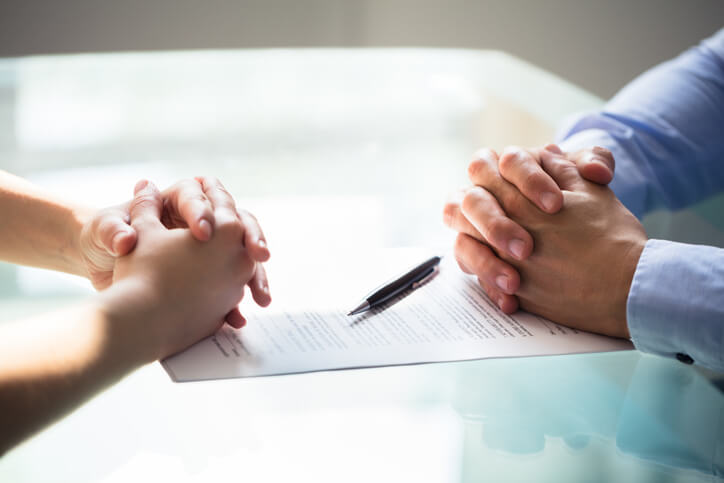 Two grads reviewing a document after regulatory affairs training